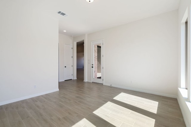 1832 Camay St, Leander, TX 78641 - spare room with light wood finished floors and recessed lighting