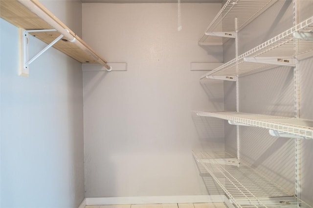 walk in closet featuring tile patterned floors