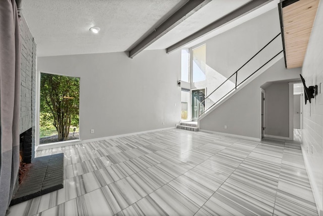 9433 Singing Quail Dr, Austin, TX 78758 - unfurnished living room with tile patterned floors, a textured ceiling, and a brick fireplace