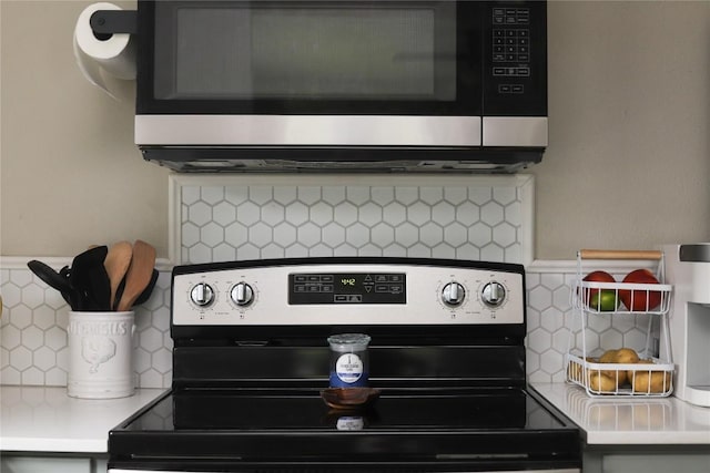 room details with light countertops, appliances with stainless steel finishes, and tasteful backsplash