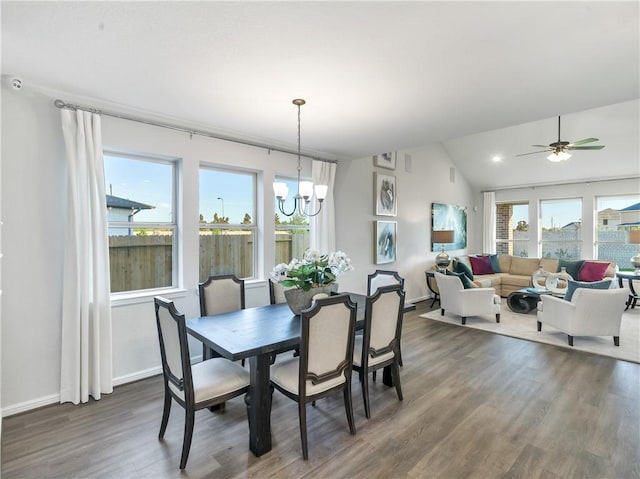 205 Bluff Creek Ln, Georgetown, TX 78628 - dining space featuring dark wood-style floors, vaulted ceiling, a chandelier, and a ceiling fan