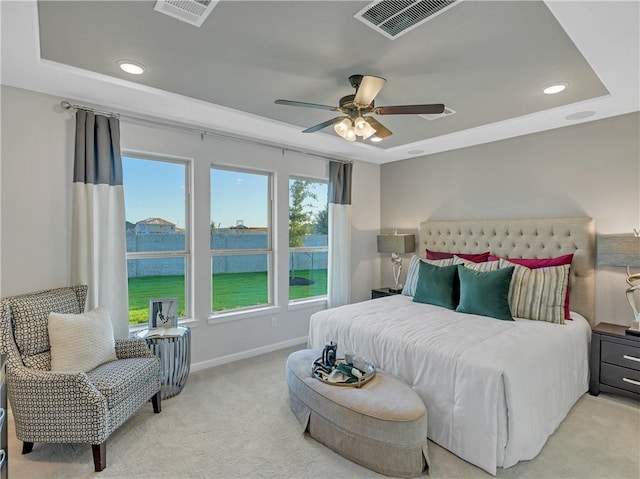 205 Bluff Creek Ln, Georgetown, TX 78628 - bedroom with light colored carpet, a raised ceiling, recessed lighting, and a ceiling fan