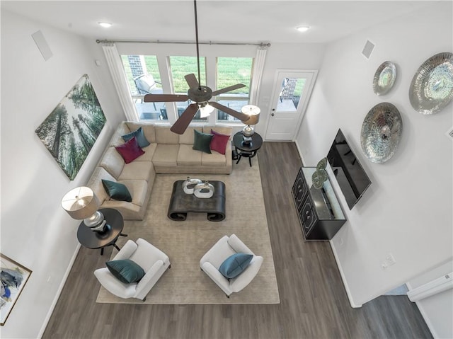 205 Bluff Creek Ln, Georgetown, TX 78628 - living area featuring wood finished floors, a ceiling fan, and healthy amount of natural light