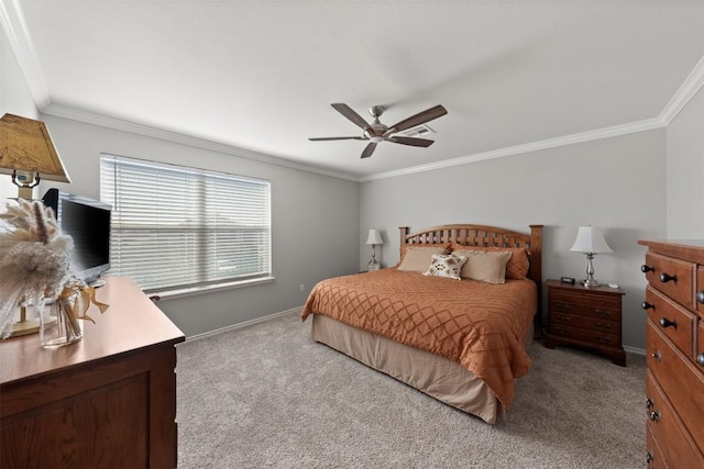 bedroom featuring carpet floors, ornamental molding, baseboards, and a ceiling fan