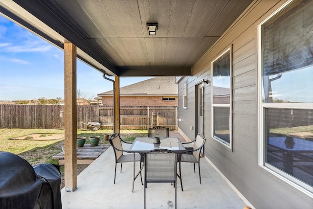 view of patio / terrace featuring outdoor dining area and fence