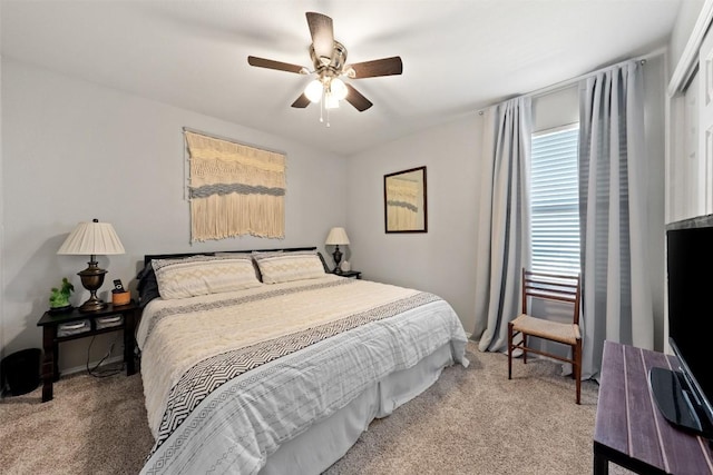 bedroom with light carpet and ceiling fan