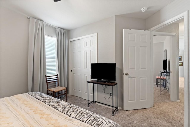 carpeted bedroom with a closet