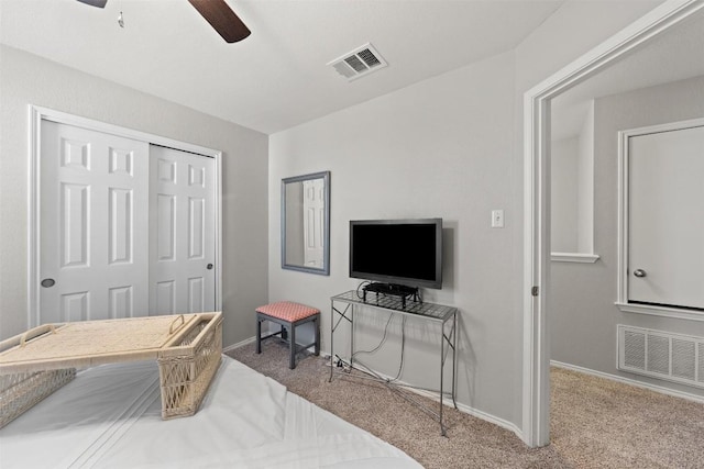 bedroom with baseboards, a closet, visible vents, and carpet flooring