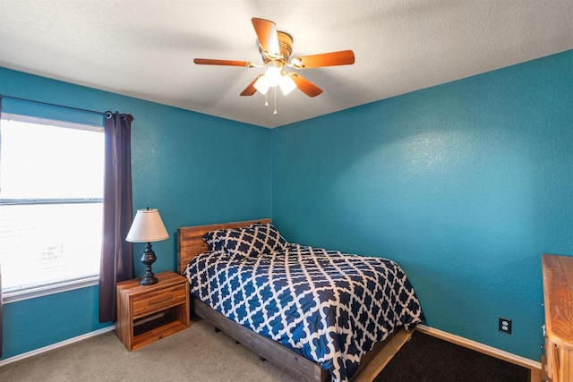 103 Ryan Cv, Hutto, TX 78634 - carpeted bedroom with multiple windows and ceiling fan