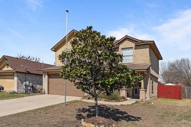 103 Ryan Cv, Hutto, TX 78634 - view of front of home featuring brick siding, concrete driveway, and an attached garage