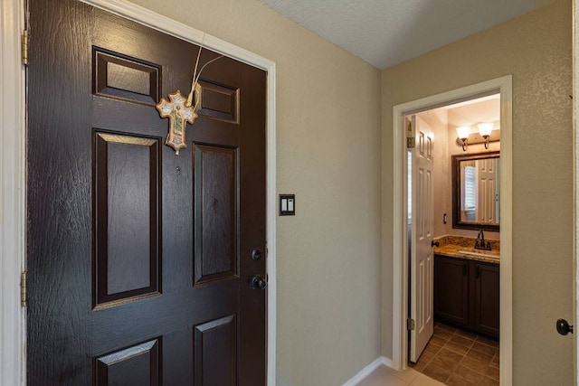 103 Ryan Cv, Hutto, TX 78634 - entryway with light tile patterned flooring and baseboards