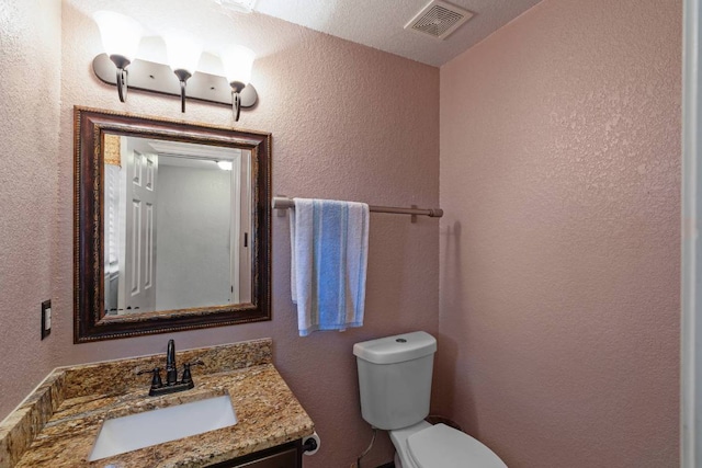 103 Ryan Cv, Hutto, TX 78634 - half bath with a textured wall and vanity