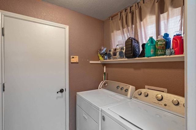 103 Ryan Cv, Hutto, TX 78634 - laundry room featuring separate washer and dryer, a textured ceiling, and a textured wall