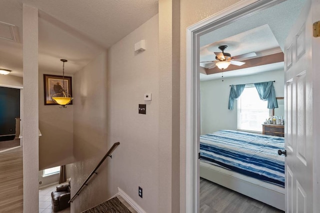 103 Ryan Cv, Hutto, TX 78634 - stairway featuring wood finished floors and a ceiling fan