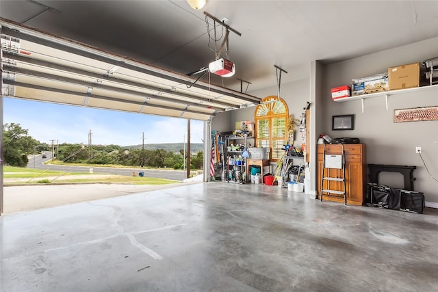 9609 Bluegrass Dr, Austin, TX 78759 - garage featuring a garage door opener