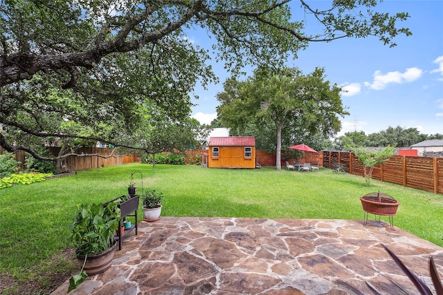 9609 Bluegrass Dr, Austin, TX 78759 - fenced backyard with a fire pit, a patio, and a storage shed