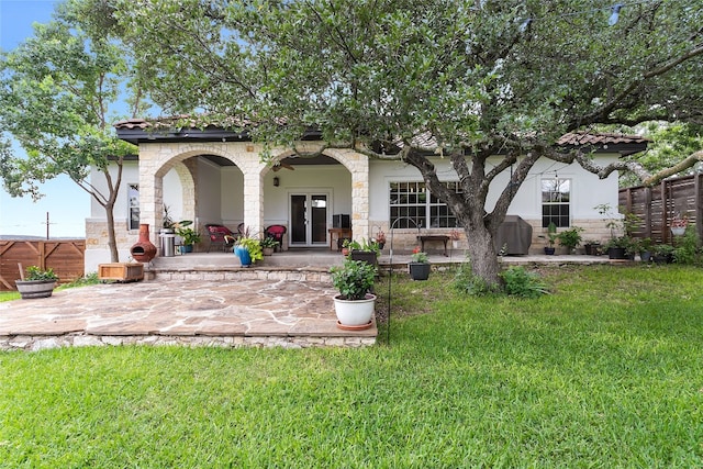 9609 Bluegrass Dr, Austin, TX 78759 - rear view of property featuring stone siding, french doors, a patio area, and stucco siding