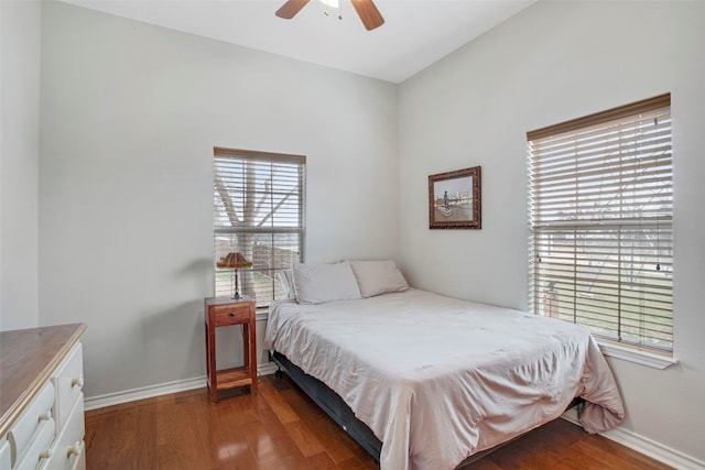 bedroom featuring ceiling fan, wood finished floors, and baseboards