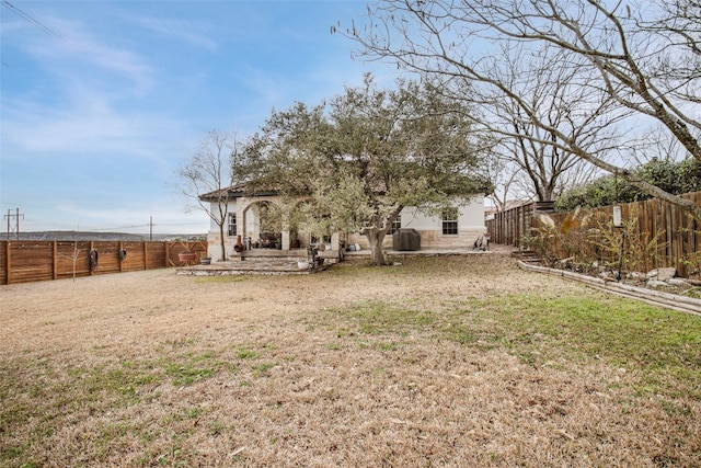 view of yard with a patio and a fenced backyard