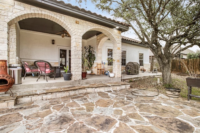 view of patio / terrace with a ceiling fan, fence, and grilling area