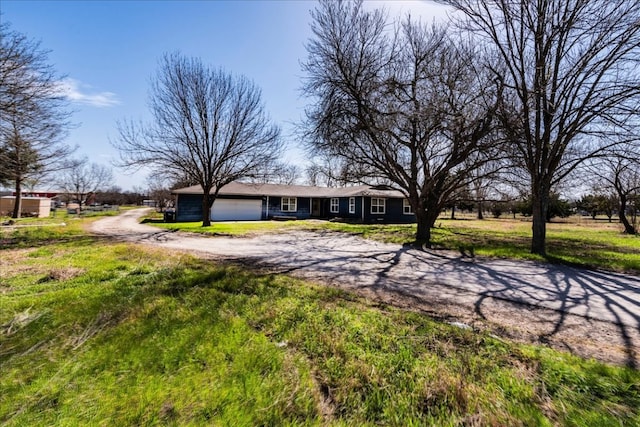 view of front facade with driveway and an attached garage