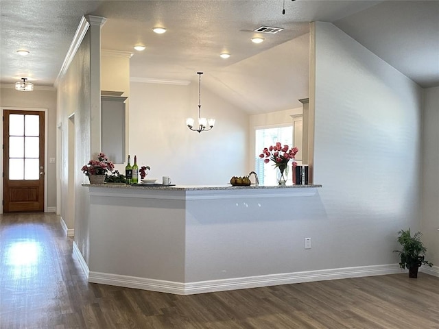 interior space with a chandelier and visible vents