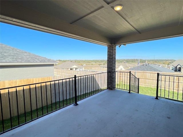 view of patio / terrace featuring a fenced backyard and a residential view