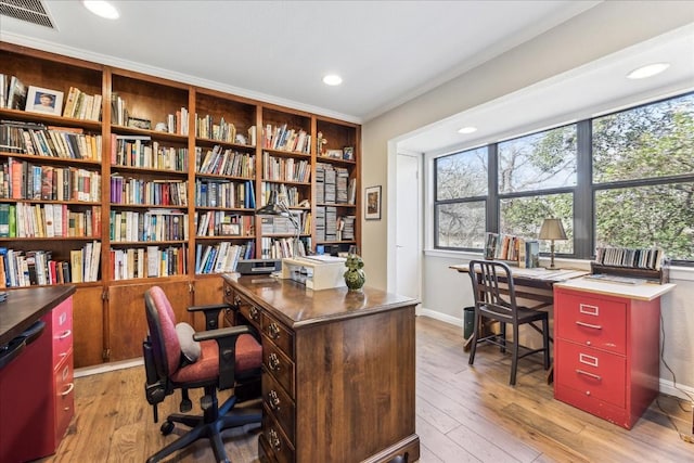 office area featuring light wood-style floors, recessed lighting, visible vents, and baseboards