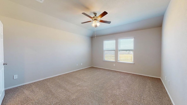 unfurnished room featuring carpet flooring, a ceiling fan, and baseboards