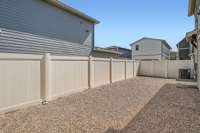 view of yard featuring a fenced backyard and cooling unit