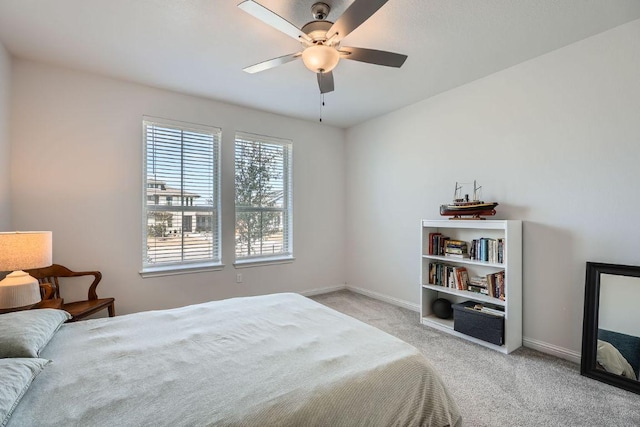 bedroom featuring carpet, baseboards, and ceiling fan