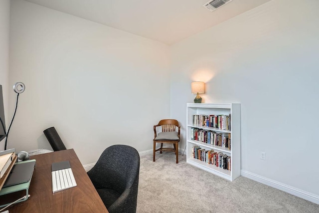 office area featuring baseboards, visible vents, and carpet flooring