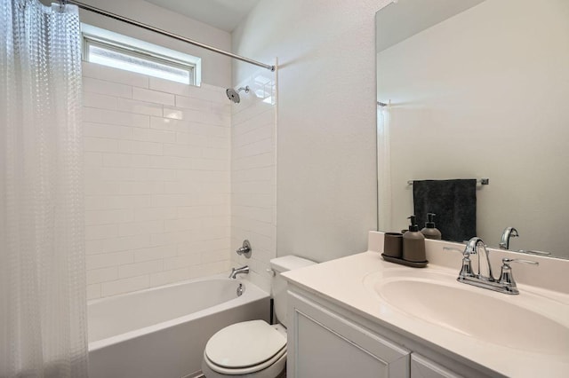 bathroom featuring toilet, shower / tub combo, and vanity