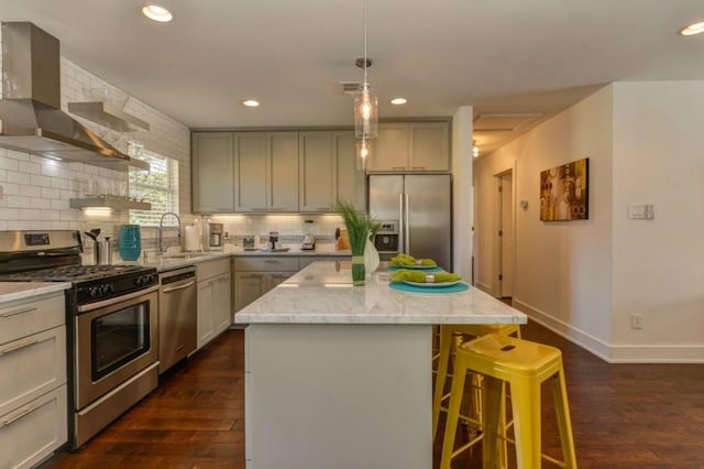 1110 W Oltorf St, Austin, TX 78704 - kitchen featuring appliances with stainless steel finishes, wall chimney exhaust hood, gray cabinets, and recessed lighting