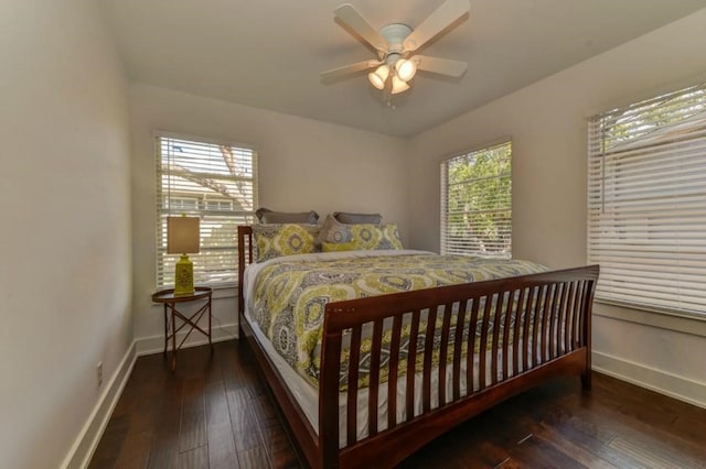 bedroom featuring a ceiling fan, hardwood / wood-style flooring, and baseboards