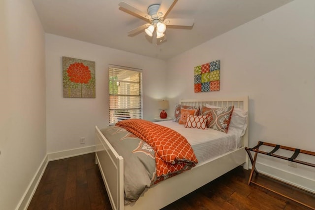 bedroom featuring a ceiling fan, baseboards, and hardwood / wood-style floors