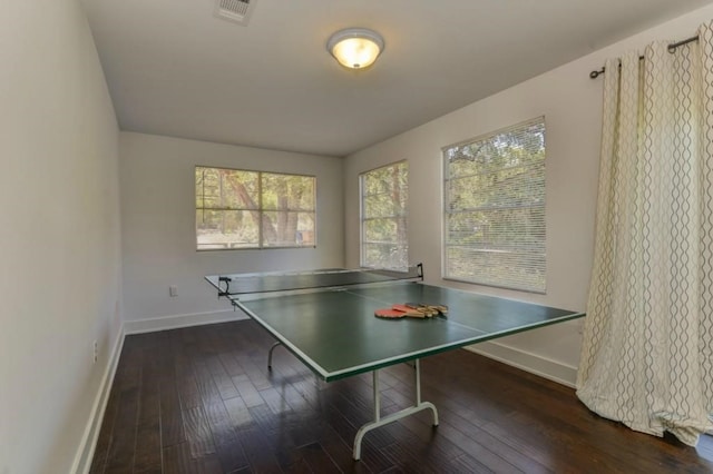 playroom with wood-type flooring, visible vents, and baseboards