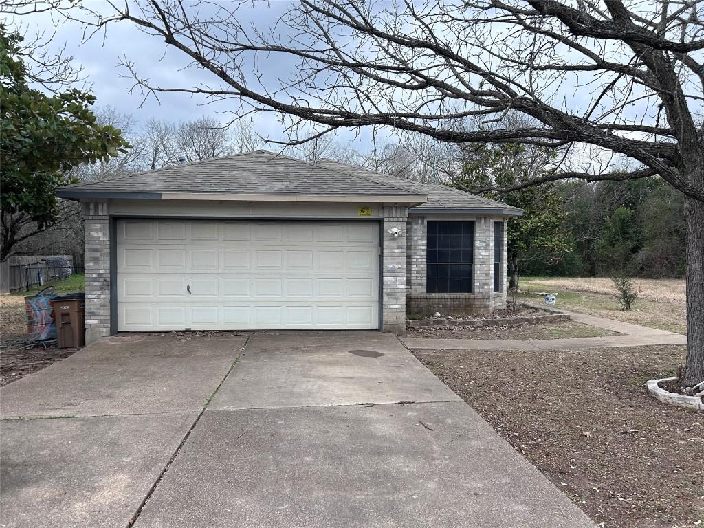 garage with driveway