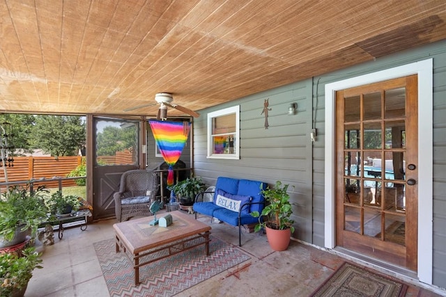 sunroom featuring wooden ceiling