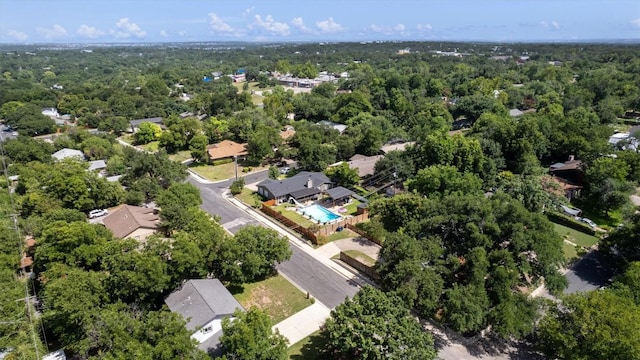 birds eye view of property with a forest view