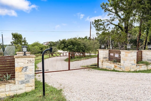 view of gate featuring fence