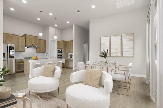 600 C-Bar Ranch Trl, Cedar Park, TX 78613 - living room with light wood-style flooring, recessed lighting, baseboards, and a towering ceiling