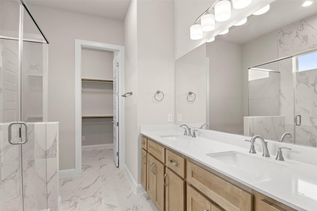 600 C-Bar Ranch Trl, Cedar Park, TX 78613 - bathroom featuring marble finish floors, a marble finish shower, double vanity, a spacious closet, and baseboards