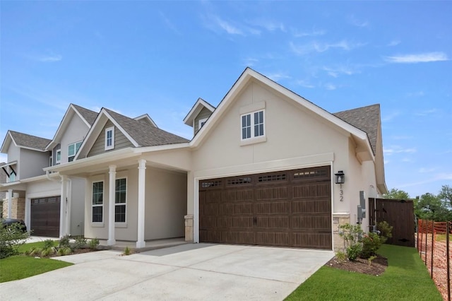 600 C-Bar Ranch Trl, Cedar Park, TX 78613 - view of front of house with concrete driveway, stucco siding, a shingled roof, and a garage