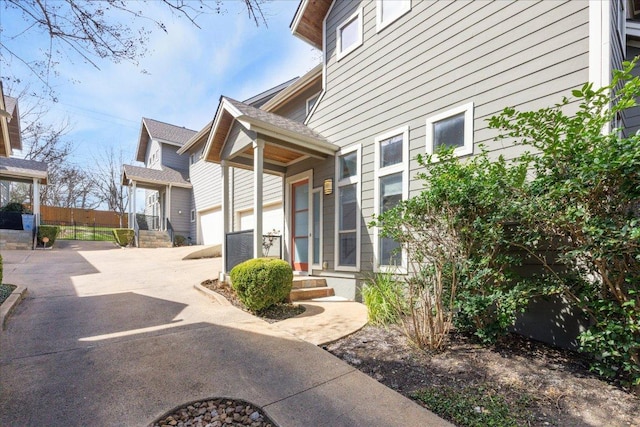 exterior space featuring a garage and concrete driveway