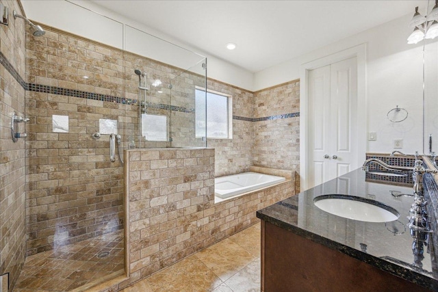 bathroom with tile patterned floors, a shower stall, a bath, and vanity