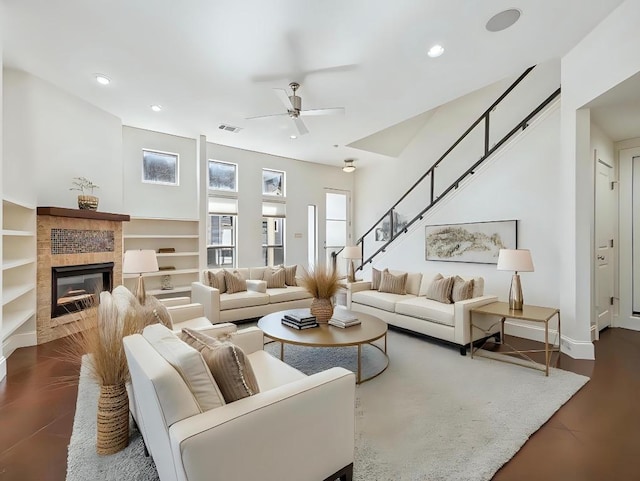 3816 Ridgelea Dr Unit A, Austin, TX 78731 - living room featuring a ceiling fan, recessed lighting, stairs, a tile fireplace, and dark wood-style floors