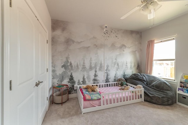 bedroom with ceiling fan, a closet, and carpet flooring