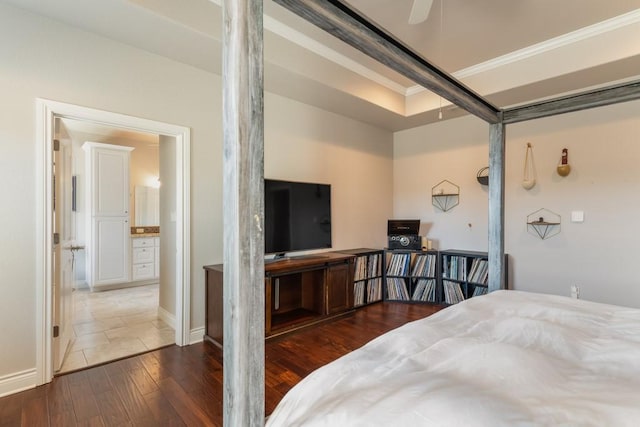 bedroom featuring crown molding and wood finished floors