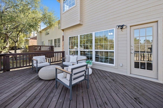 wooden terrace featuring outdoor lounge area